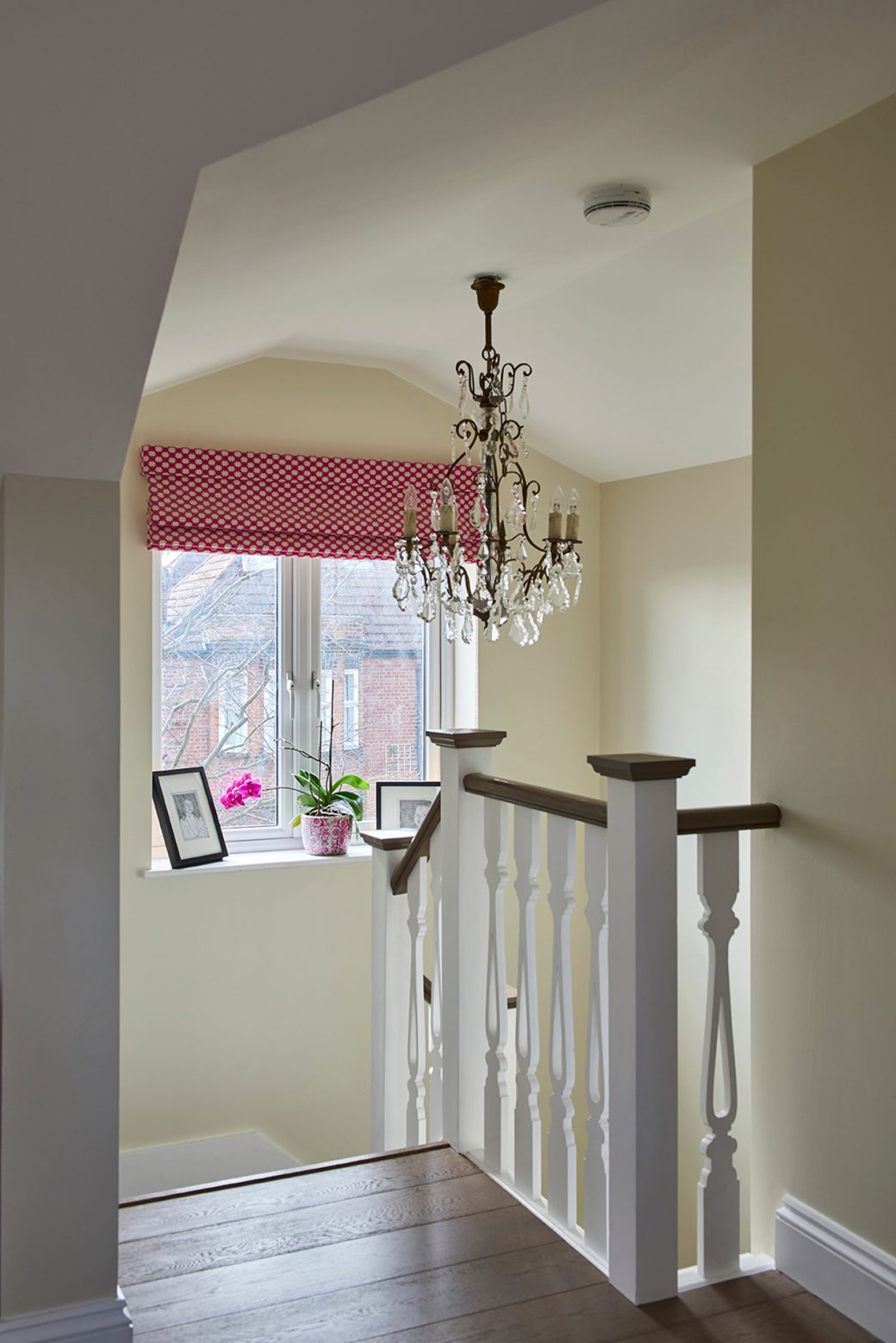 Top of stairs with chandelier